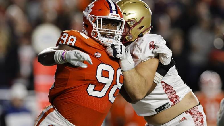 Oct 8, 2022; Chestnut Hill, Massachusetts, USA; Clemson Tigers defensive end Myles Murphy (98) fights to get past Boston College Eagles offensive lineman Ozzy Trapilo (70) during the second quarter at Alumni Stadium. Mandatory Credit: Winslow Townson-USA TODAY Sports