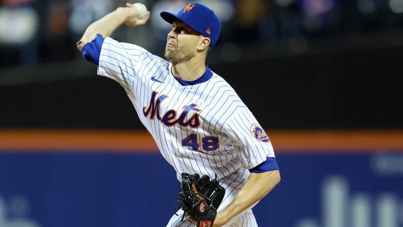 Oct 8, 2022; New York City, New York, USA; New York Mets starting pitcher Jacob deGrom (48) throws a pitch in the first inning during  game two of the Wild Card series against the San Diego Padres for the 2022 MLB Playoffs at Citi Field. Mandatory Credit: Brad Penner-USA TODAY Sports