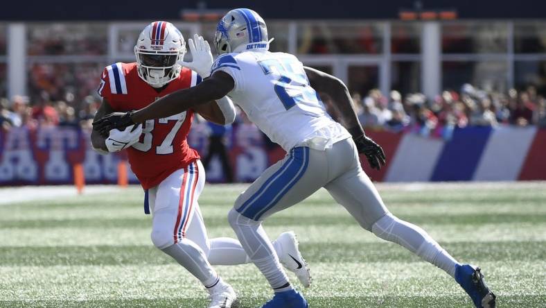 Oct 9, 2022; Foxborough, Massachusetts, USA; New England Patriots running back Damien Harris (37) runs with the ball while Detroit Lions safety Will Harris (25) defends during the first half at Gillette Stadium. Mandatory Credit: Bob DeChiara-USA TODAY Sports