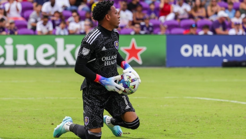 Oct 9, 2022; Orlando, Florida, USA; Orlando City goalkeeper Pedro Gallese (1) makes a save during the first half against the Columbus Crew at Exploria Stadium. Mandatory Credit: Mike Watters-USA TODAY Sports