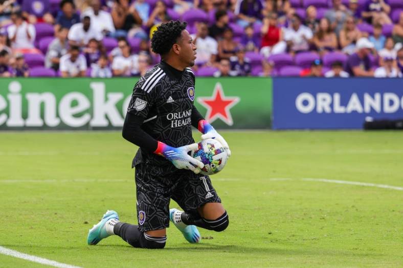 Oct 9, 2022; Orlando, Florida, USA; Orlando City goalkeeper Pedro Gallese (1) makes a save during the first half against the Columbus Crew at Exploria Stadium. Mandatory Credit: Mike Watters-USA TODAY Sports