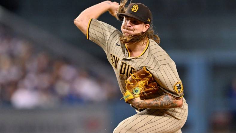 Oct 11, 2022; Los Angeles, California, USA; San Diego Padres pitcher Mike Clevinger (52) throws in the first inning of game one of the NLDS for the 2022 MLB Playoffs against the Los Angeles Dodgers at Dodger Stadium. Mandatory Credit: Jayne Kamin-Oncea-USA TODAY Sports