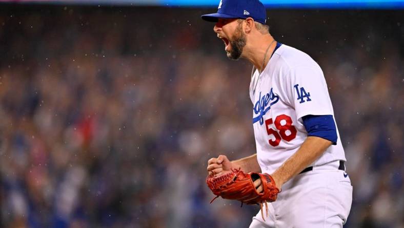 Oct 11, 2022; Los Angeles, California, USA; Los Angeles Dodgers relief pitcher Chris Martin (58) reacts after defeating the San Diego Padres during game one of the NLDS for the 2022 MLB Playoffs at Dodger Stadium. Mandatory Credit: Jayne Kamin-Oncea-USA TODAY Sports