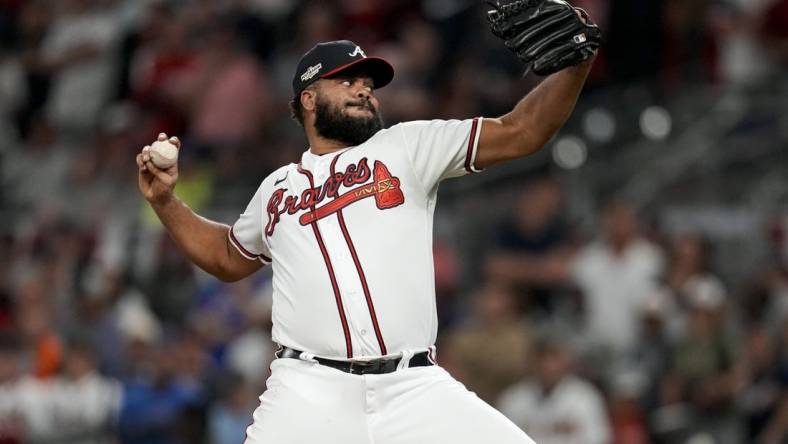 Oct 12, 2022; Atlanta, Georgia, USA; Atlanta Braves relief pitcher Kenley Jansen (74) throws against the Philadelphia Phillies in the ninth inning during game two of the NLDS for the 2022 MLB Playoffs at Truist Park. Mandatory Credit: Dale Zanine-USA TODAY Sports