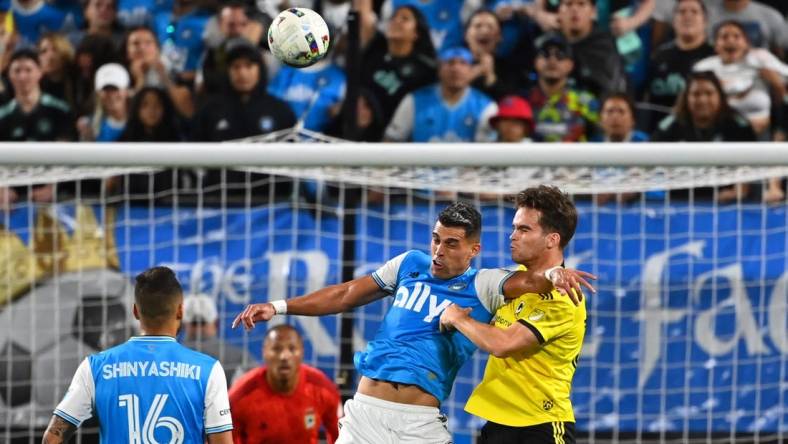 Oct 5, 2022; Charlotte, North Carolina, USA; Charlotte FC forward Daniel Rios (12) and Columbus Crew defender Will Sands (30) fight for the header in the second half at Bank of America Stadium. Mandatory Credit: Bob Donnan-USA TODAY Sports