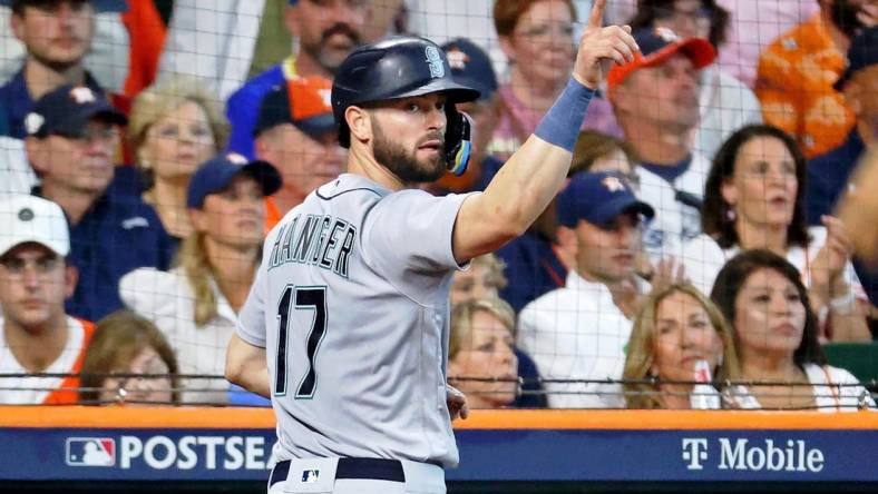 Oct 13, 2022; Houston, Texas, USA; Seattle Mariners right fielder Mitch Haniger (17) reacts after scoring against the Houston Astros on a a one-run RBI single hit by left fielder Dylan Moore (not pictured) during the fourth inning of game two of the ALDS for the 2022 MLB Playoffs at Minute Maid Park. Mandatory Credit: Troy Taormina-USA TODAY Sports