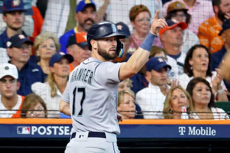 Oct 13, 2022; Houston, Texas, USA; Seattle Mariners right fielder Mitch Haniger (17) reacts after scoring against the Houston Astros on a a one-run RBI single hit by left fielder Dylan Moore (not pictured) during the fourth inning of game two of the ALDS for the 2022 MLB Playoffs at Minute Maid Park. Mandatory Credit: Troy Taormina-USA TODAY Sports