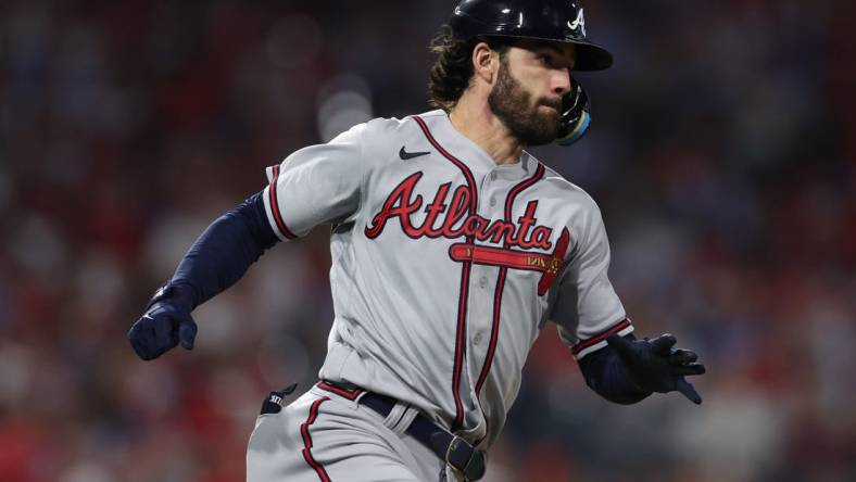 Oct 14, 2022; Philadelphia, Pennsylvania, USA; Atlanta Braves shortstop Dansby Swanson hits a double against the Philadelphia Phillies during the 6th inning in game three of the NLDS for the 2022 MLB Playoffs at Citizens Bank Park. Mandatory Credit: Bill Streicher-USA TODAY Sports