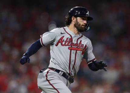 Oct 14, 2022; Philadelphia, Pennsylvania, USA; Atlanta Braves shortstop Dansby Swanson hits a double against the Philadelphia Phillies during the 6th inning in game three of the NLDS for the 2022 MLB Playoffs at Citizens Bank Park. Mandatory Credit: Bill Streicher-USA TODAY Sports