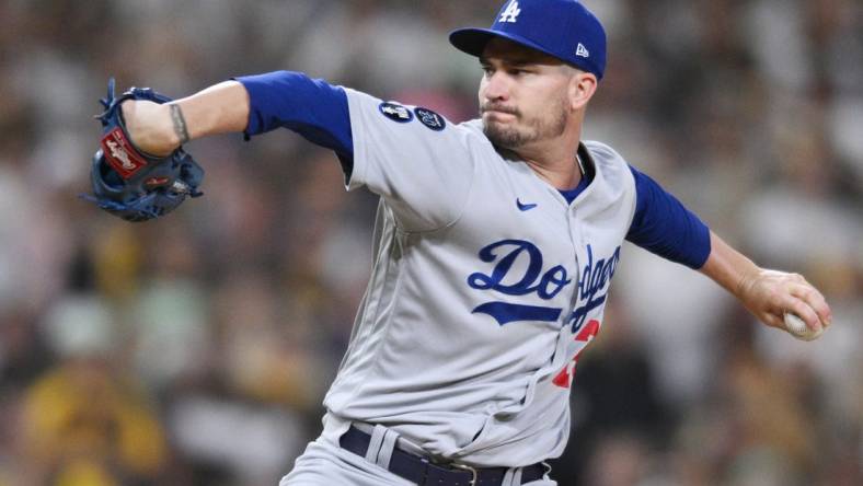 Oct 14, 2022; San Diego, California, USA; Los Angeles Dodgers starting pitcher Andrew Heaney (28) throws a pitch in the second inning against the San Diego Padres during game three of the NLDS for the 2022 MLB Playoffs at Petco Park. Mandatory Credit: Orlando Ramirez-USA TODAY Sports