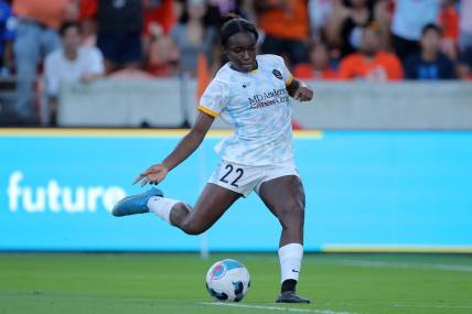 Oct 16, 2022; Houston, Texas, USA; Houston Dash forward Michelle Alozie (22) handles the ball during the second half against the Kansas City Current at PNC Stadium. Mandatory Credit: Erik Williams-USA TODAY Sports