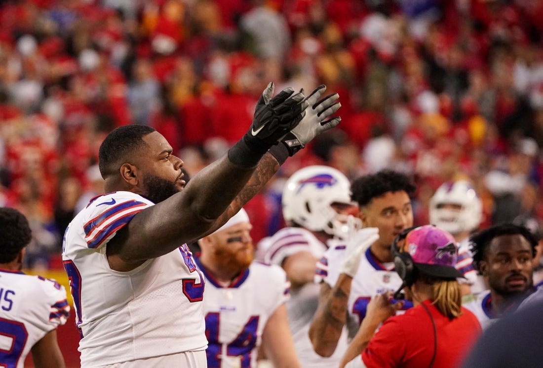 Oct 16, 2022; Kansas City, Missouri, USA; Buffalo Bills defensive tackle Jordan Phillips (97) celebrates toward fans against the Kansas City Chiefs during the second half at GEHA Field at Arrowhead Stadium. Mandatory Credit: Denny Medley-USA TODAY Sports