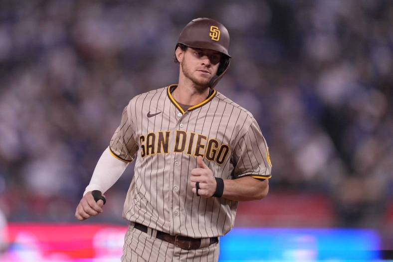 Oct 11, 2022; Los Angeles, California, USA; San Diego Padres right fielder Wil Myers (5) rounds the bases after hitting a home run during the fifth inning of game one of the NLDS for the 2022 MLB Playoffs against the Los Angeles Dodgers at Dodger Stadium. Mandatory Credit: Kirby Lee-USA TODAY Sports