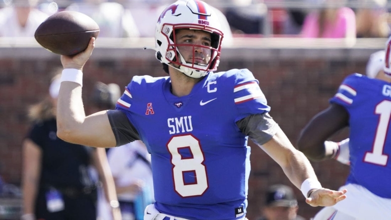 Oct 22, 2022; Dallas, Texas, USA; Southern Methodist Mustangs quarterback Tanner Mordecai (8) throws downfield during the first half against the Cincinnati Bearcats at Gerald J. Ford Stadium. Mandatory Credit: Raymond Carlin III-USA TODAY Sports