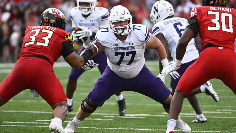 Oct 22, 2022; College Park, Maryland, USA; Northwestern Wildcats offensive lineman Peter Skoronski (77) prepares to block against the Maryland Terrapins at SECU Stadium. Mandatory Credit: Brad Mills-USA TODAY Sports