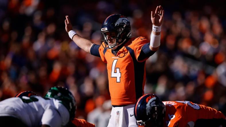 Oct 23, 2022; Denver, Colorado, USA; Denver Broncos quarterback Brett Rypien (4) motions at the line of scrimmage in the first quarter against the New York Jets at Empower Field at Mile High. Mandatory Credit: Isaiah J. Downing-USA TODAY Sports