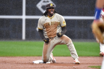 Oct 23, 2022; Philadelphia, Pennsylvania, USA; San Diego Padres first baseman Josh Bell (24) reacts after driving in the tying run in the seventh inning during game five of the NLCS against the Philadelphia Phillies for the 2022 MLB Playoffs at Citizens Bank Park. Mandatory Credit: Eric Hartline-USA TODAY Sports