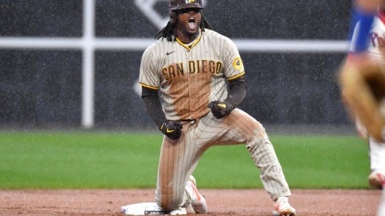 Oct 23, 2022; Philadelphia, Pennsylvania, USA; San Diego Padres first baseman Josh Bell (24) reacts after driving in the tying run in the seventh inning during game five of the NLCS against the Philadelphia Phillies for the 2022 MLB Playoffs at Citizens Bank Park. Mandatory Credit: Eric Hartline-USA TODAY Sports