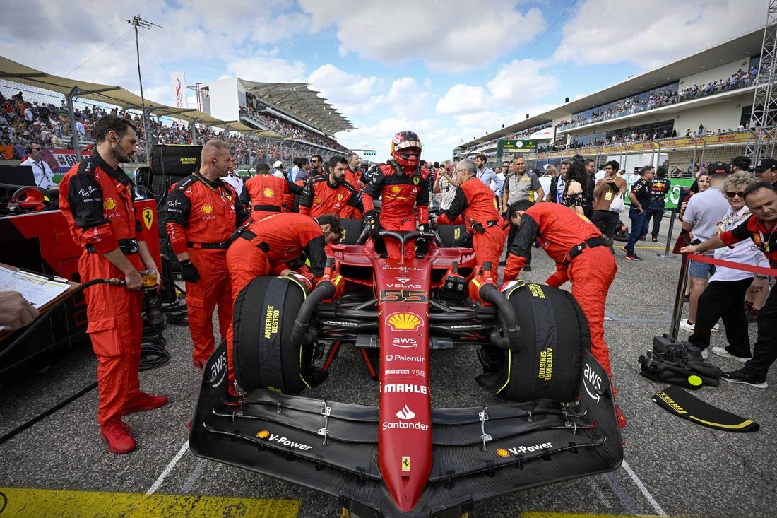 Oct 23, 2022; Austin, Texas, USA; Scuderia Ferrari driver Carlos Sainz (55) of Team Spain exits his car before the start of the U.S. Grand Prix F1 race at Circuit of the Americas. Mandatory Credit: Jerome Miron-USA TODAY Sports