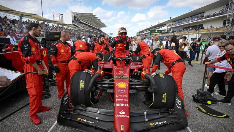 Oct 23, 2022; Austin, Texas, USA; Scuderia Ferrari driver Carlos Sainz (55) of Team Spain exits his car before the start of the U.S. Grand Prix F1 race at Circuit of the Americas. Mandatory Credit: Jerome Miron-USA TODAY Sports