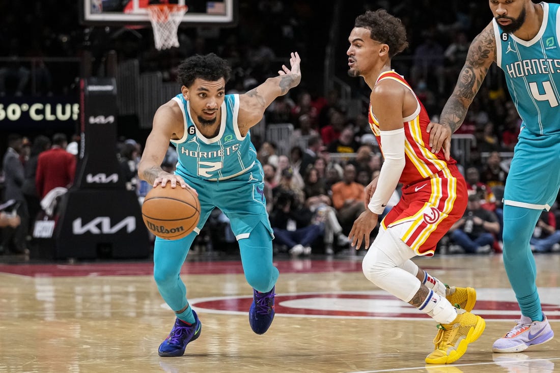 Oct 23, 2022; Atlanta, Georgia, USA; Charlotte Hornets guard James Bouknight (2) dribbles past Atlanta Hawks guard Trae Young (11) during the second half at State Farm Arena. Mandatory Credit: Dale Zanine-USA TODAY Sports