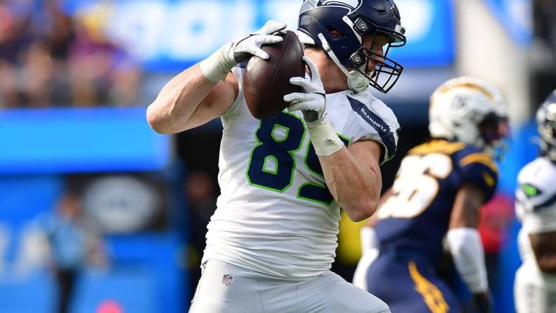 Oct 23, 2022; Inglewood, California, USA; Seattle Seahawks tight end Will Dissly (89) runs the ball after a catch against the Los Angeles Chargers during the first half at SoFi Stadium. Mandatory Credit: Gary A. Vasquez-USA TODAY Sports