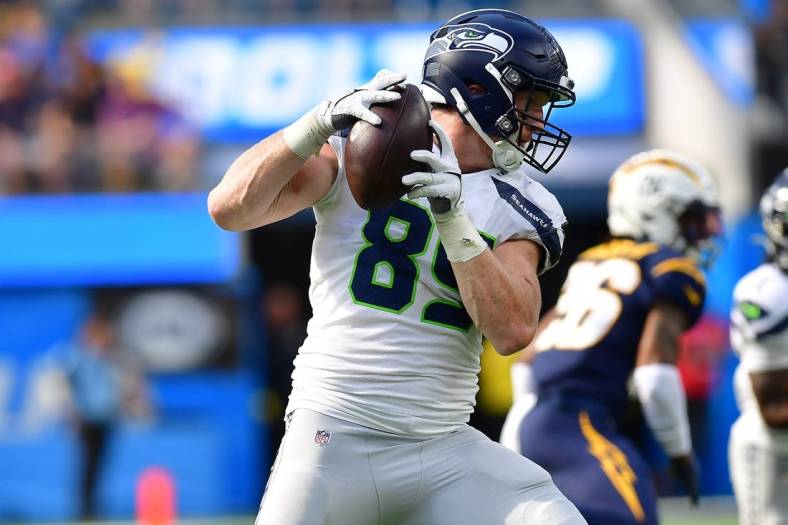Oct 23, 2022; Inglewood, California, USA; Seattle Seahawks tight end Will Dissly (89) runs the ball after a catch against the Los Angeles Chargers during the first half at SoFi Stadium. Mandatory Credit: Gary A. Vasquez-USA TODAY Sports