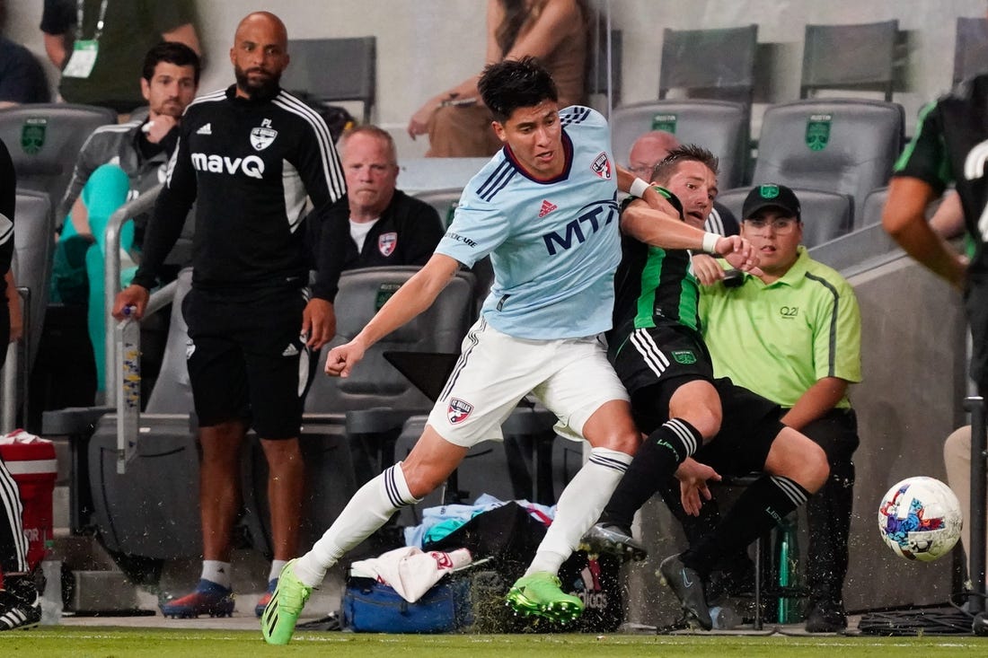 Oct 23, 2022; Austin, Texas, US; FC Dallas defender Marco Farfan (4) and Austin FC midfielder Ethan Finlay (13) fight for the ball during the second half of a conference semifinal of the Audi 2022 MLS Cup Playoffs at Q2 Stadium. Mandatory Credit: Scott Wachter-USA TODAY Sports