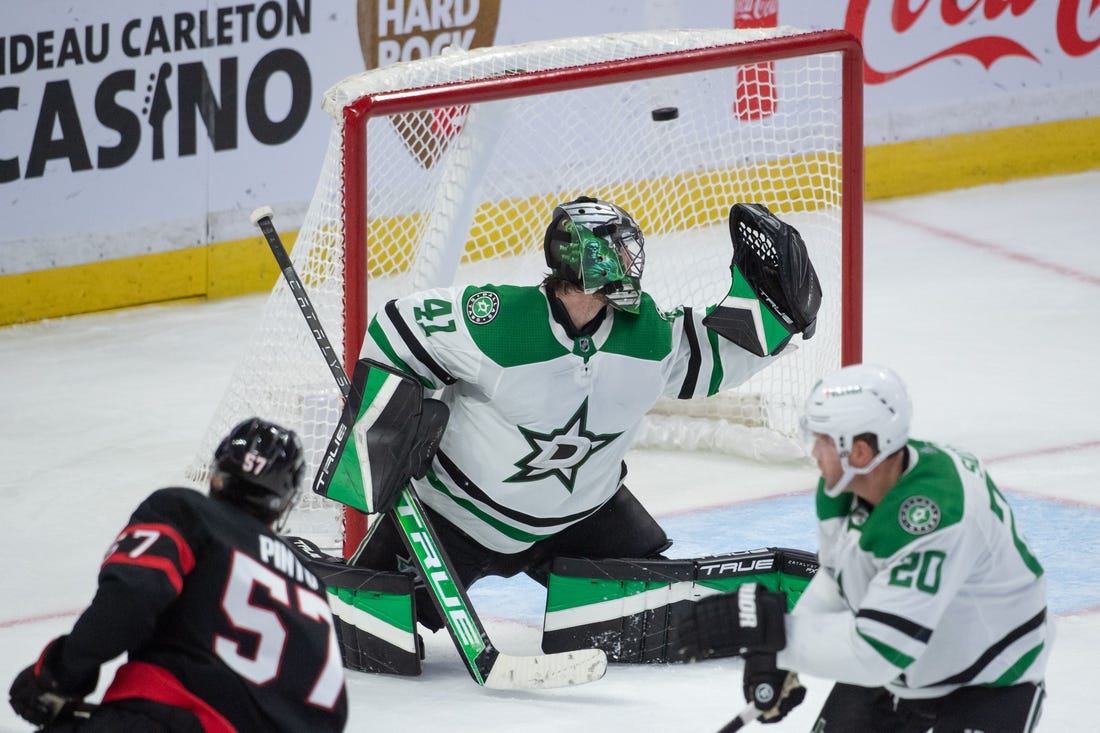 Oct 24, 2022; Ottawa, Ontario, CAN; Ottawa Senators center Shane Pinto (57) scores against Dallas Stars goalie Scott Wedgewood (41) in the third period at the Canadian Tire Centre. Mandatory Credit: Marc DesRosiers-USA TODAY Sports