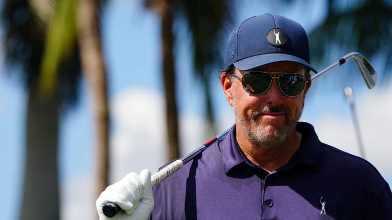 Oct 28, 2022; Miami, Florida, USA; Phil Mickelson warms up on the ninth tee box during the first round of the season finale of the LIV Golf series at Trump National Doral. Mandatory Credit: John David Mercer-USA TODAY Sports