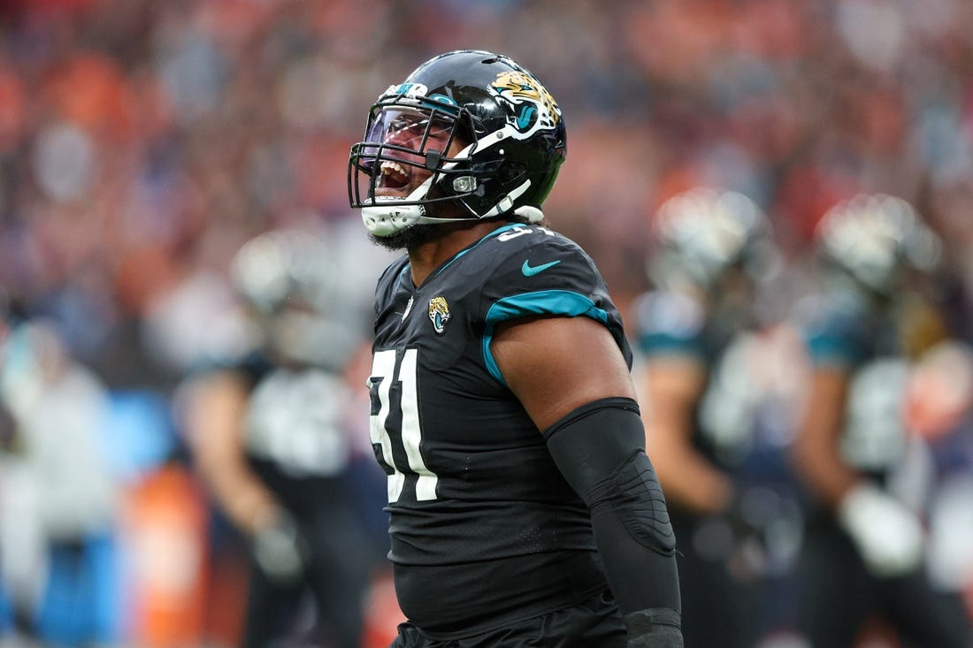 Oct 30, 2022; London, United Kingdom, Jacksonville Jaguars defensive end Dawuane Smoot (91) reacts affecter sacking Denver Broncos quarterback Russell Wilson (3) (not pictured) in the third quarter during an NFL International Series game at Wembley Stadium. Mandatory Credit: Nathan Ray Seebeck-USA TODAY Sports