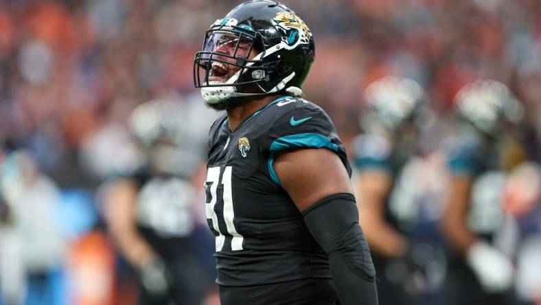 Oct 30, 2022; London, United Kingdom, Jacksonville Jaguars defensive end Dawuane Smoot (91) reacts affecter sacking Denver Broncos quarterback Russell Wilson (3) (not pictured) in the third quarter during an NFL International Series game at Wembley Stadium. Mandatory Credit: Nathan Ray Seebeck-USA TODAY Sports