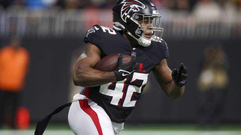 Oct 30, 2022; Atlanta, Georgia, USA; Atlanta Falcons running back Caleb Huntley (42) runs the ball against the Carolina Panthers in the second quarter at Mercedes-Benz Stadium. Mandatory Credit: Brett Davis-USA TODAY Sports