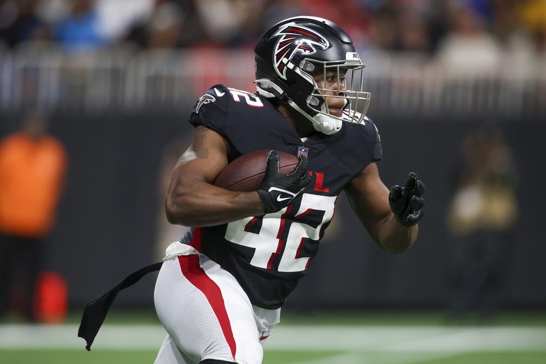 Oct 30, 2022; Atlanta, Georgia, USA; Atlanta Falcons running back Caleb Huntley (42) runs the ball against the Carolina Panthers in the second quarter at Mercedes-Benz Stadium. Mandatory Credit: Brett Davis-USA TODAY Sports