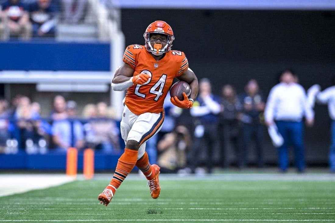 Oct 30, 2022; Arlington, Texas, USA; Chicago Bears running back Khalil Herbert (24) runs for a first down against the Dallas Cowboys during the second half at AT&T Stadium. Mandatory Credit: Jerome Miron-USA TODAY Sports