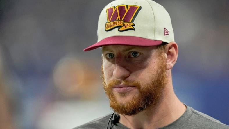 Washington Commanders quarterback Carson Wentz (11) walks along the sideline Sunday, Oct. 30, 2022, during a game against the Indianapolis Colts at Indianapolis Colts at Lucas Oil Stadium in Indianapolis.