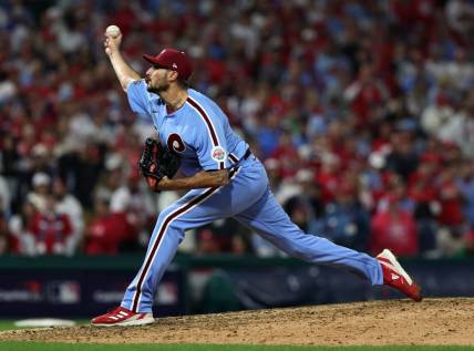 Nov 3, 2022; Philadelphia, Pennsylvania, USA; Philadelphia Phillies relief pitcher Zach Eflin (56) shows a pitch against the Houston Astros during the ninth inning in game five of the 2022 World Series at Citizens Bank Park. Mandatory Credit: Bill Streicher-USA TODAY Sports