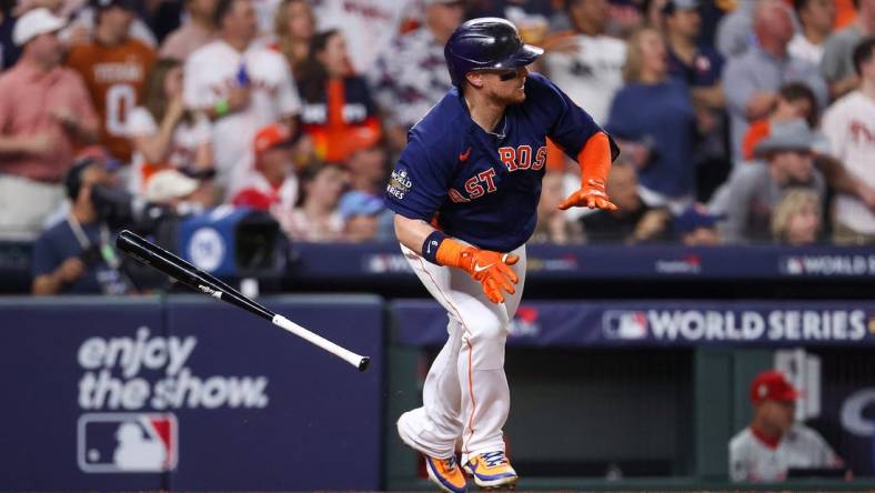 Nov 5, 2022; Houston, Texas, USA; Houston Astros designated hitter Christian Vazquez (9) hits a one run single against the Philadelphia Phillies during the sixth inning in game six of the 2022 World Series at Minute Maid Park. Mandatory Credit: Troy Taormina-USA TODAY Sports