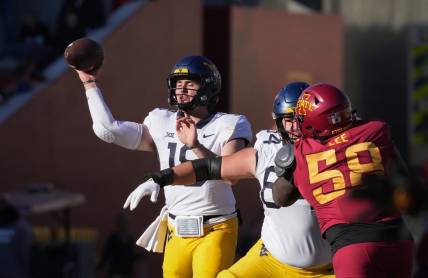 West Virginia quarterback JT Daniels throws a pass in the second quarter against Iowa State during a NCAA football game at Jack Trice Stadium in Ames on Saturday, Nov. 5, 2022.

Iowastatevswvu 202201105 Bh