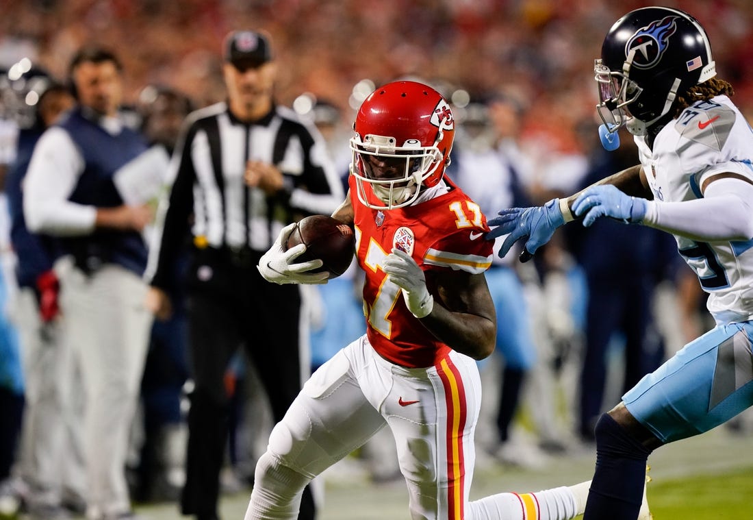 Nov 6, 2022; Kansas City, Missouri, USA; Kansas City Chiefs wide receiver Mecole Hardman (17) races past Tennessee Titans cornerback Terrance Mitchell (39) during the second quarter  at GEHA Field at Arrowhead Stadium. Mandatory Credit: George Walker IV / Tennessean.com