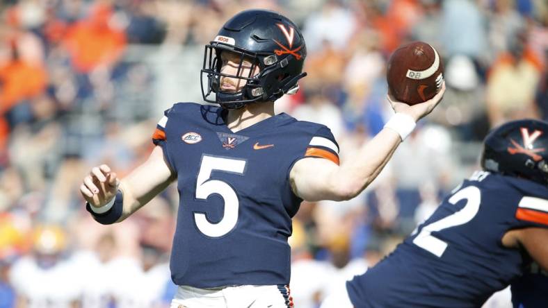 Nov 12, 2022; Charlottesville, Virginia, USA; Virginia Cavaliers quarterback Brennan Armstrong (5) throws the ball against the Pittsburgh Panthers during the first half at Scott Stadium. Mandatory Credit: Amber Searls-USA TODAY Sports