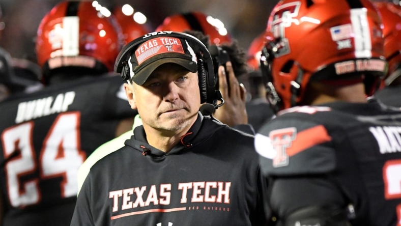 Texas Tech's head football coach Joey McGuire stands on the sidelines during a timeout against Kansas in a Big 12 football game, Saturday, Nov. 12, 2022, at Jones AT&T Stadium.