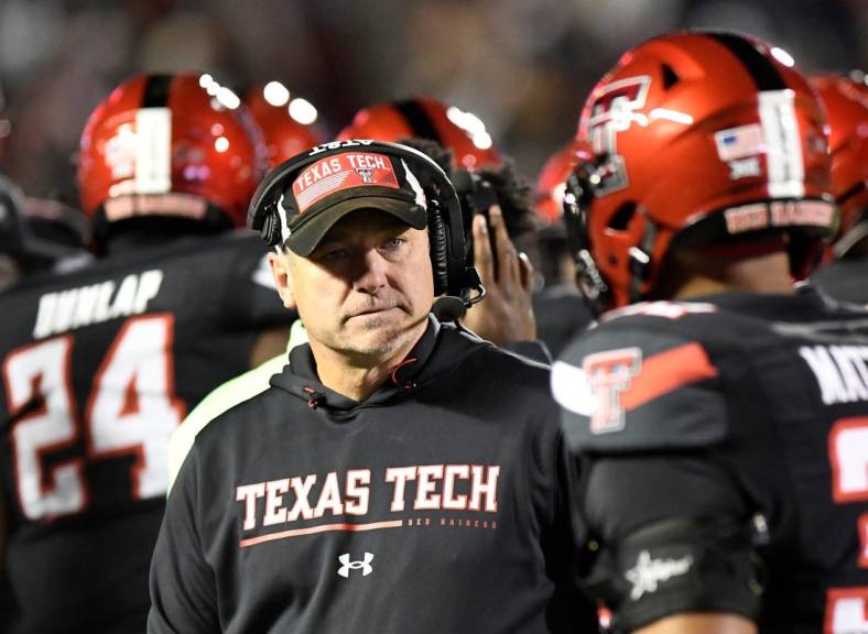 Texas Tech's head football coach Joey McGuire stands on the sidelines during a timeout against Kansas in a Big 12 football game, Saturday, Nov. 12, 2022, at Jones AT&T Stadium.
