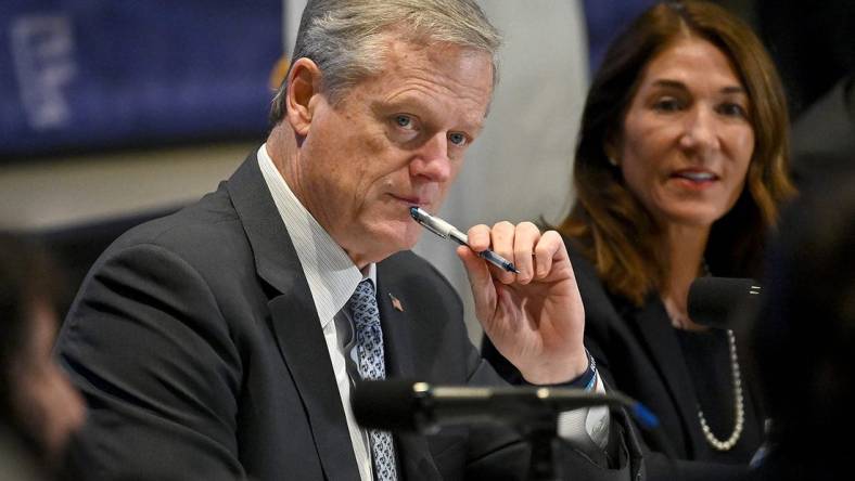 Gov. Charlie Baker listens to Framingham High School students during a roundtable discussion on the state's Early College program at MassBay Community College in Framingham, Nov. 17, 2022.