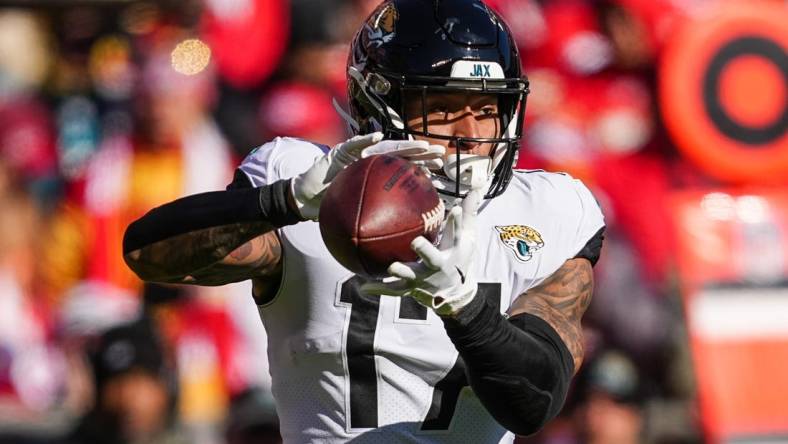 Nov 13, 2022; Kansas City, Missouri, USA; Jacksonville Jaguars running back Travis Etienne Jr. (1) runs the ball during the first half against the Kansas City Chiefs at GEHA Field at Arrowhead Stadium. Mandatory Credit: Jay Biggerstaff-USA TODAY Sports