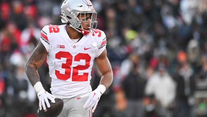 Nov 19, 2022; College Park, Maryland, USA; Ohio State Buckeyes running back TreVeyon Henderson (32) reacts after scoring a first quarter touchdown against the Maryland Terrapins  at SECU Stadium. Mandatory Credit: Tommy Gilligan-USA TODAY Sports