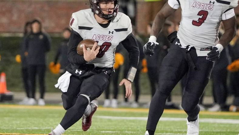 Nov 19, 2022; Columbia, Missouri, USA; New Mexico State Aggies quarterback Diego Pavia (10) runs the ball against the Missouri Tigers during the first half at Faurot Field at Memorial Stadium. Mandatory Credit: Denny Medley-USA TODAY Sports