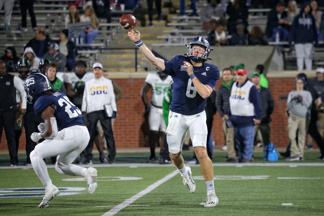 Georgia Southern quarterback Kyle Vantrease (6) passes while running back Jalen Whitehurst says in to block against Marshall.

Gasovsmarshallffortunesmn202230