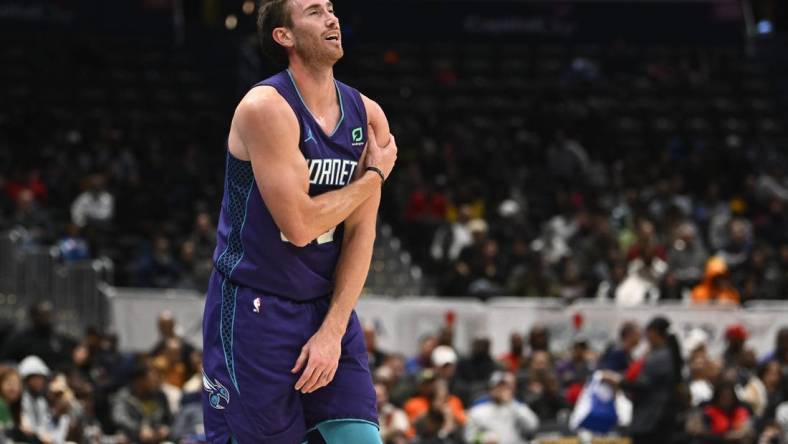 Nov 20, 2022; Washington, District of Columbia, USA; Charlotte Hornets forward Gordon Hayward (20) grabs his shoulder against the Washington Wizards during the second half at Capital One Arena. Mandatory Credit: Brad Mills-USA TODAY Sports