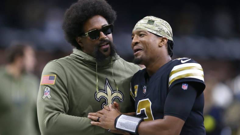 Nov 20, 2022; New Orleans, Louisiana, USA; Injured New Orleans Saints defensive end Cameron Jordan walks off the field with quarterback Jameis Winston (2) at the end of their game against the Los Angeles Rams at the Caesars Superdome. Mandatory Credit: Chuck Cook-USA TODAY Sports